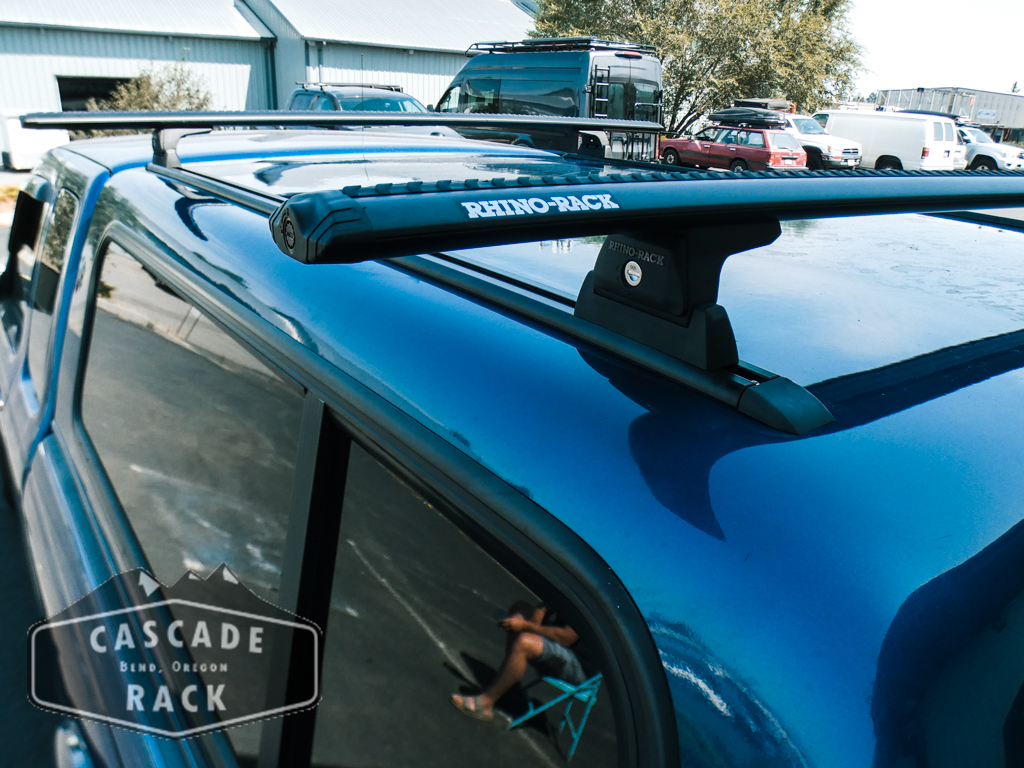 2005 Ford Ranger – Custom Track onto Fiberglass Canopy – Rhino Rack Crossbars